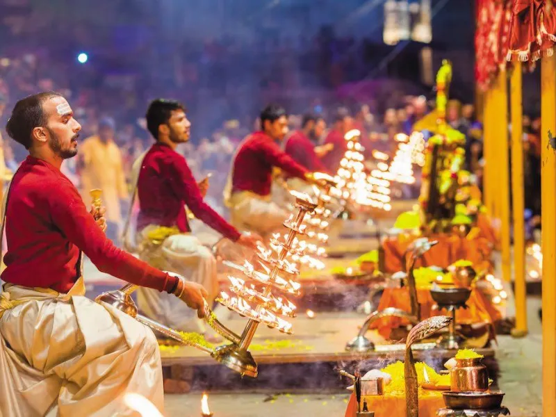 a woman scubas in the ocean with a camera